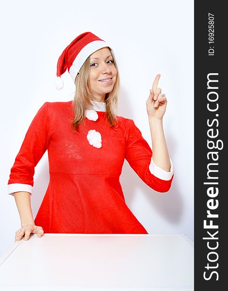 Beautiful young smiling girl in Santa red hat