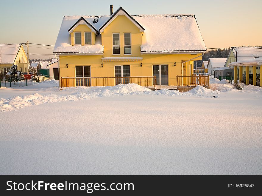 Country house in pink sunset light in winter. Country house in pink sunset light in winter