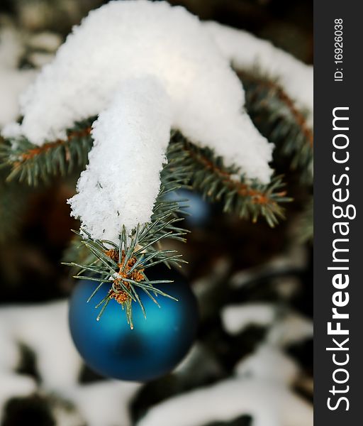 Christmas-tree decoration (green glass ball) on the tree outdoor. Christmas-tree decoration (green glass ball) on the tree outdoor