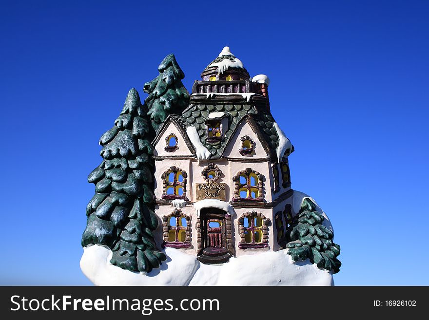 A Christmas decoration of a model village inn at Christmas. A Christmas decoration of a model village inn at Christmas.