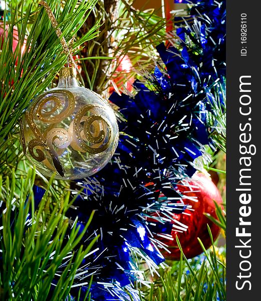 Blue tinsel and glass balls on Christmas-tree. Blue tinsel and glass balls on Christmas-tree