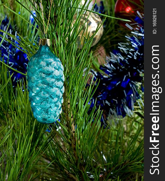 Blue glass cone and balls and tinsel on Christmas-tree. Blue glass cone and balls and tinsel on Christmas-tree