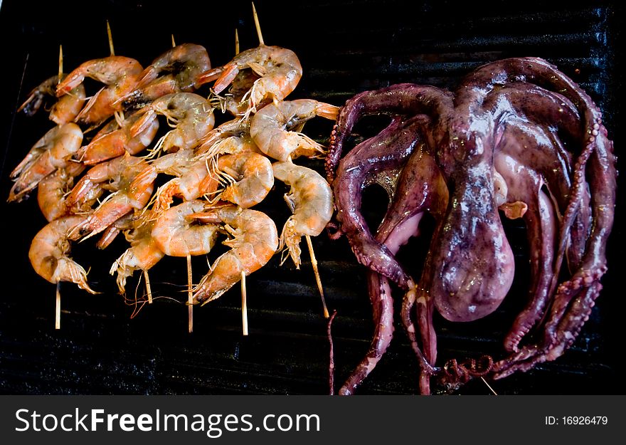 Octopus and shrimps on electric grill