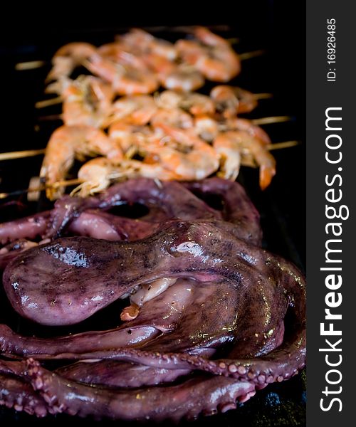 Octopus and shrimps on electric grill