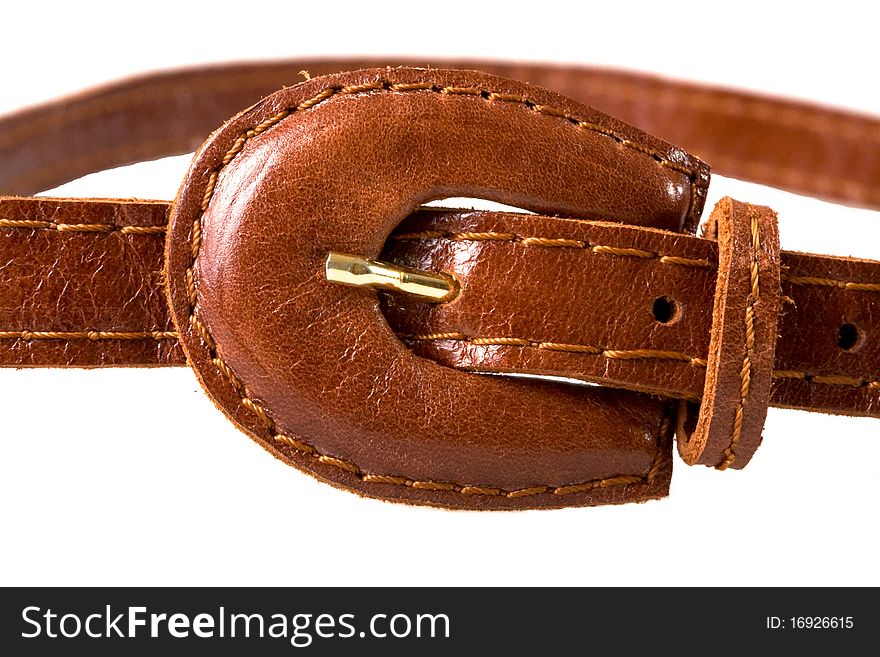 Leather brown buckle of woman's belt. Leather brown buckle of woman's belt