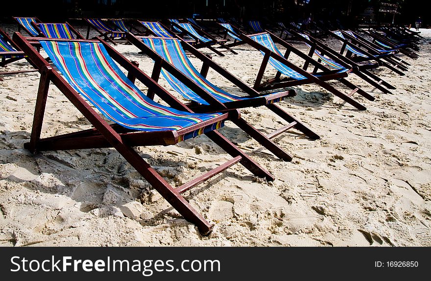 Wooden rest bench for rent on the beach. Wooden rest bench for rent on the beach