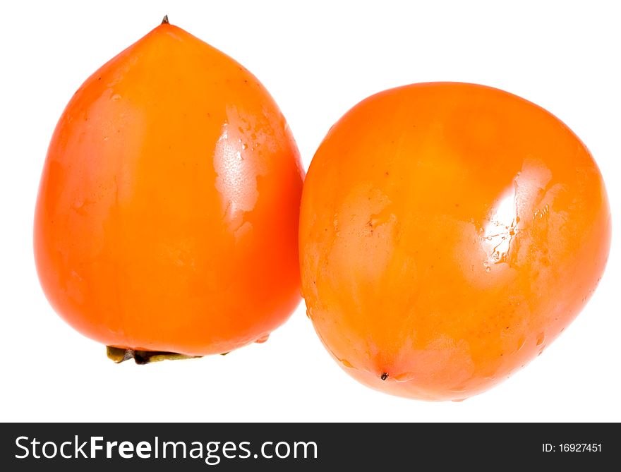 Two washed persimmon isolated on white. Two washed persimmon isolated on white