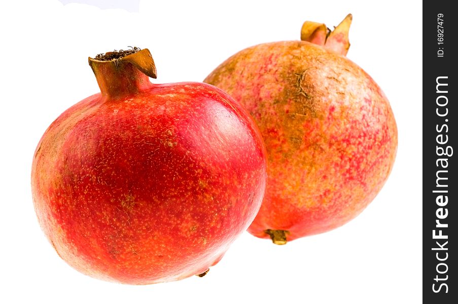 Two pomegranates isolated on white