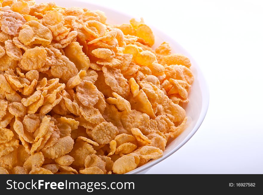 Goldish corn flakes. Macro with extremely shallow dof. Close-up of cornflakes.