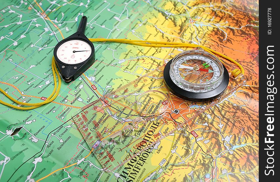 Travel compass with ruler and curvimeter on the map. Travel compass with ruler and curvimeter on the map