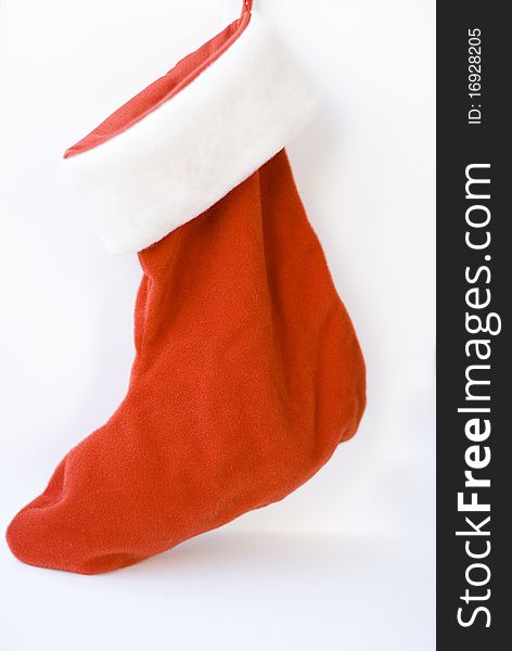 A red Christmas sock isolated on white background