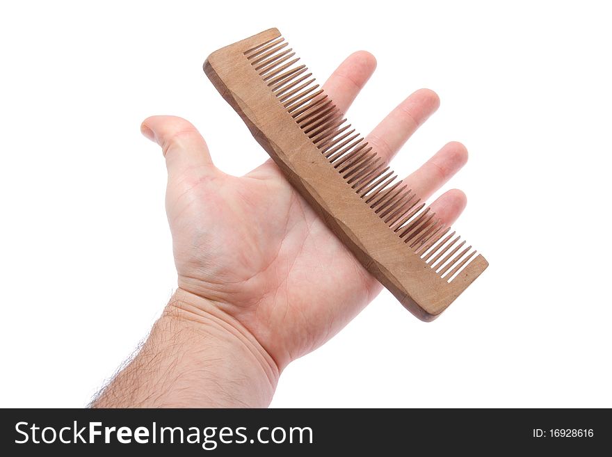 Comb in hand on white background