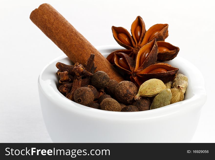 Christmas spices in a white mortar