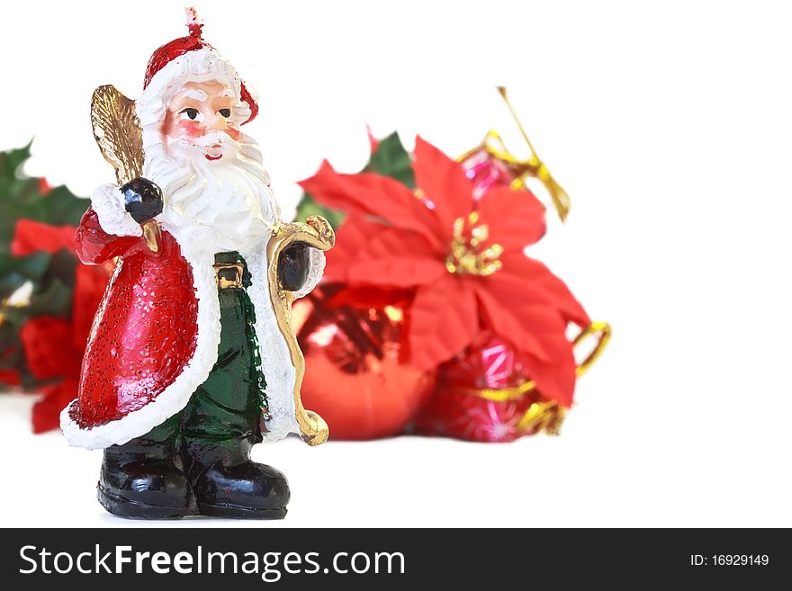 Santa Claus candle with christmas decoration isolated on white