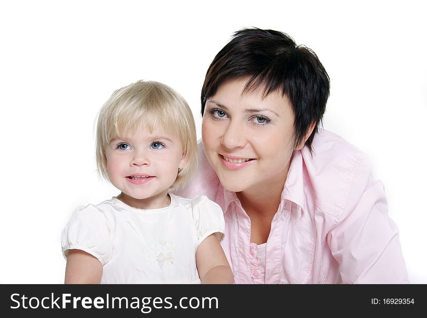 Studio portrait of attractive mother and daughter over white. Studio portrait of attractive mother and daughter over white