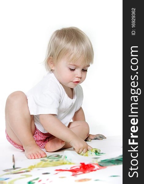 Toddler girl painting over white