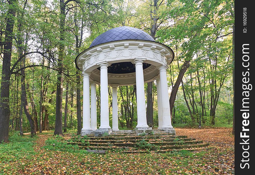 Old classical summerhouse in estate Sukhanovo, near Moscow, Russia. Autumn season