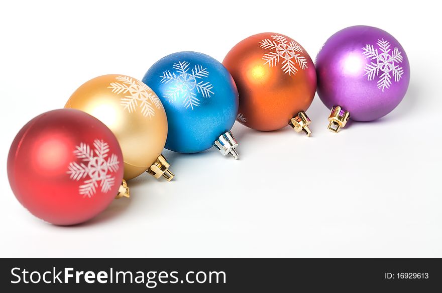 Christmas baubles over white background