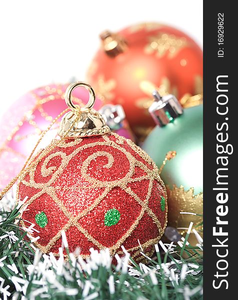Christmas baubles with red one in front. Shallow depth of field