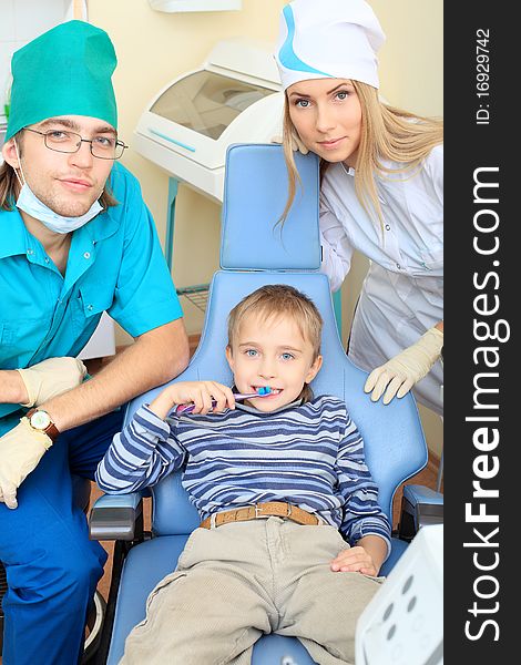 Shot of a little boy with dentists in a dental surgery. Healthcare, medicine. Shot of a little boy with dentists in a dental surgery. Healthcare, medicine.