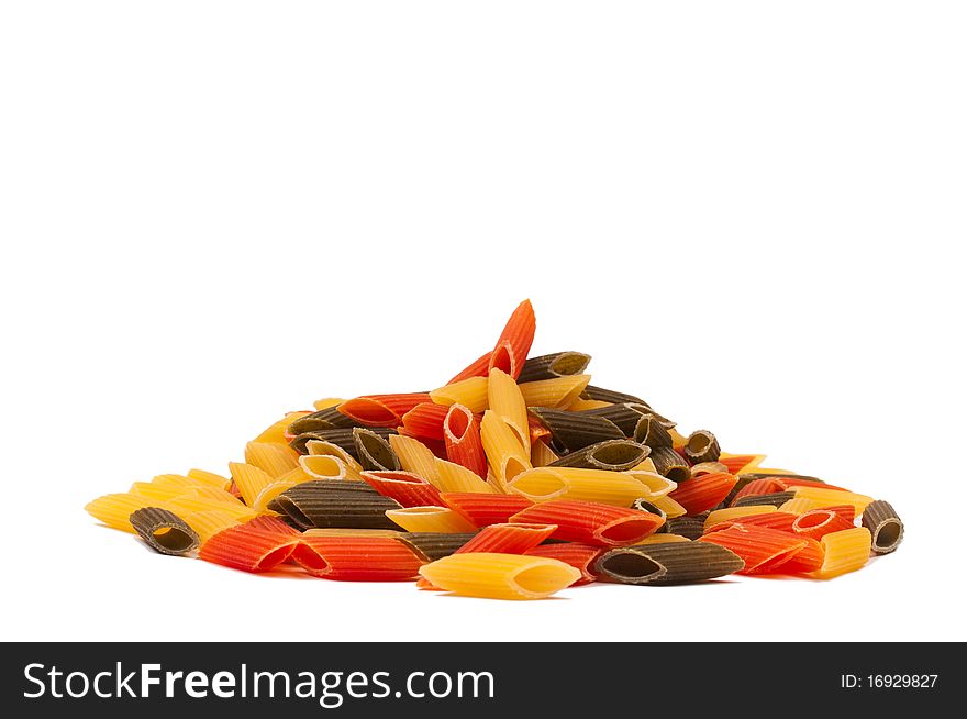 Heap of raw traditional tricolore italian pasta mezze penne isolated on white background. Heap of raw traditional tricolore italian pasta mezze penne isolated on white background