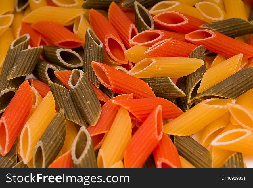 Closeup shot of raw traditional italian pasta isolated on white background. Closeup shot of raw traditional italian pasta isolated on white background