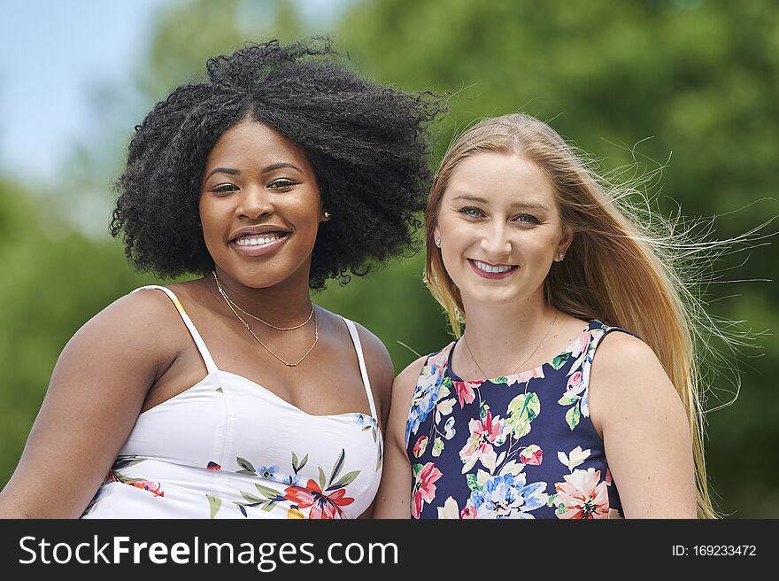 Two beautiful women friends in park for picnic
