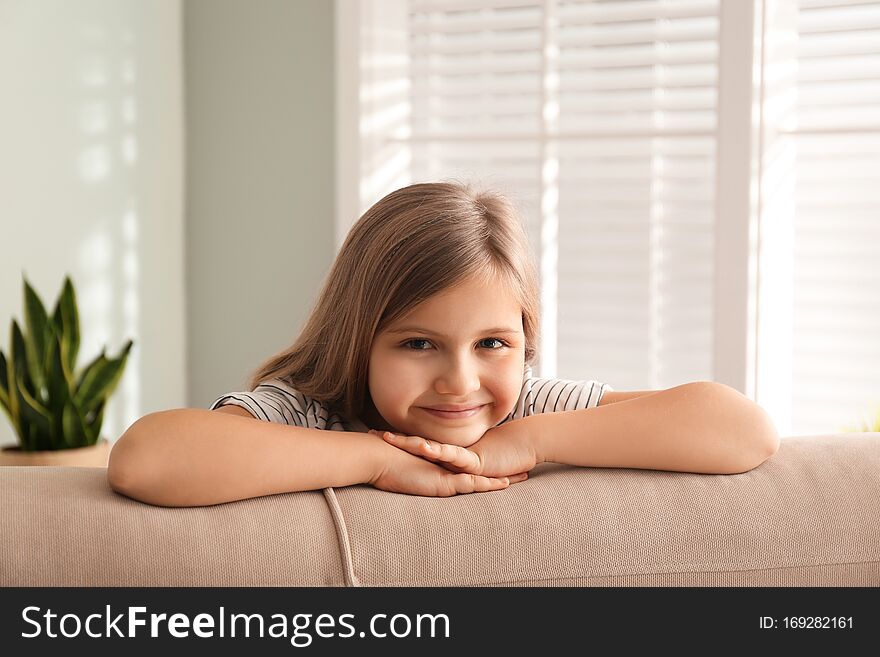 Cute little girl on couch