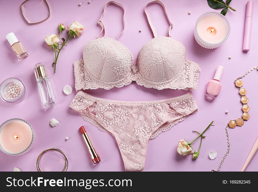 Flat lay composition with sexy women`s underwear on background