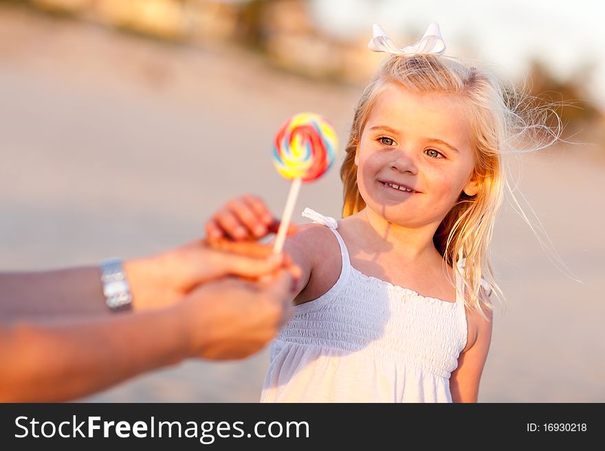 Adorable Little Girl Picking Out Lollipop
