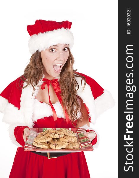 Mrs Santa is holding a big plate of cookies. Mrs Santa is holding a big plate of cookies.