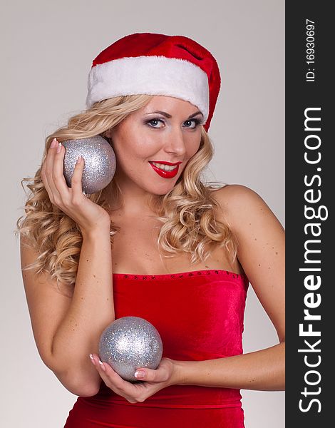 Beautiful blond girl in christmas costume in studio