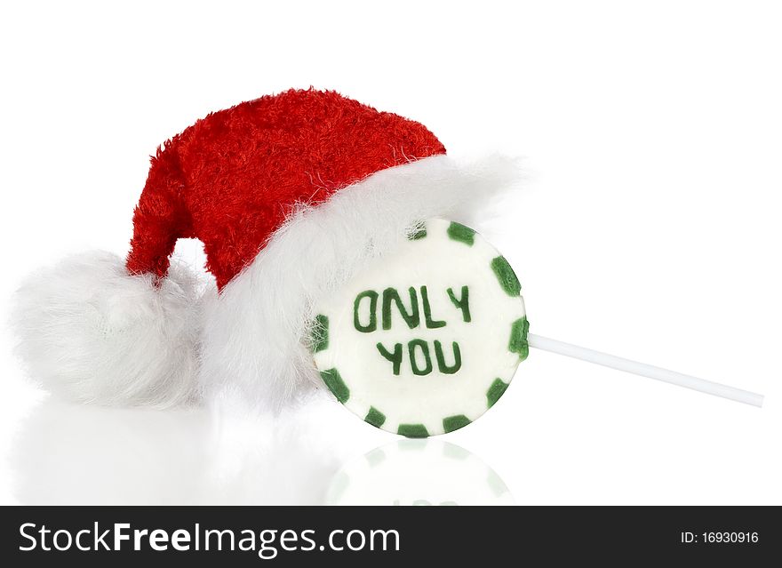 Christmas lovely Lollipop with Santa Hat isolated on white.