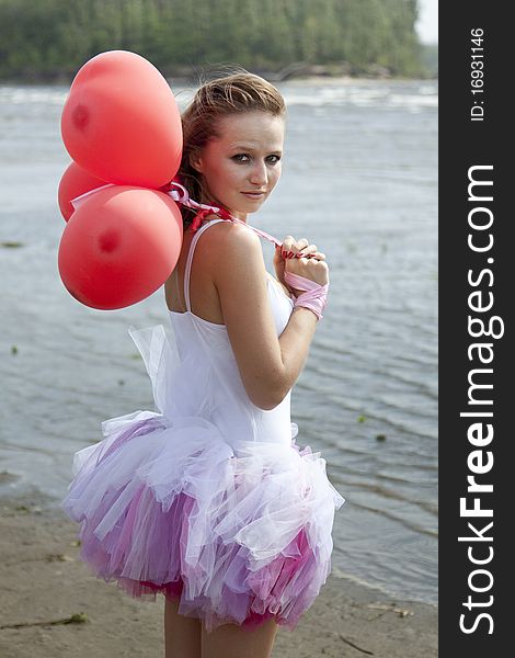 Young Beautiful Woman With Balloons.