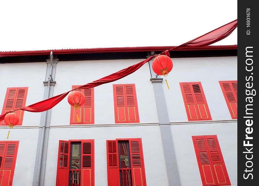 Chinese lamps with colorful building background