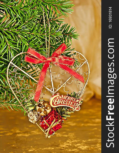 Christmas ornament, fir branch with the decor, and gold background. Christmas ornament, fir branch with the decor, and gold background.