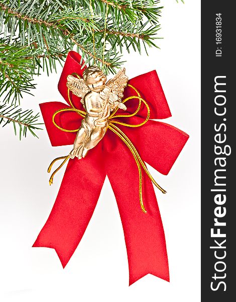 Christmas decoration angel on spruce branch. Isolated on a white background. Christmas decoration angel on spruce branch. Isolated on a white background.