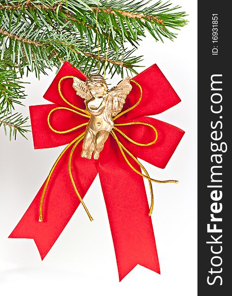 Christmas decoration angel on spruce branch. Isolated on a white background. Christmas decoration angel on spruce branch. Isolated on a white background.