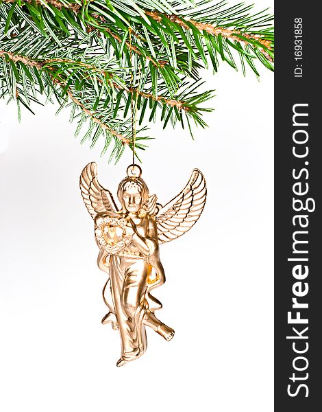 Christmas decoration angel on spruce branch. Isolated on a white background. Christmas decoration angel on spruce branch. Isolated on a white background.