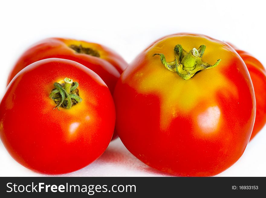 Homegrown red tomatoes on white background