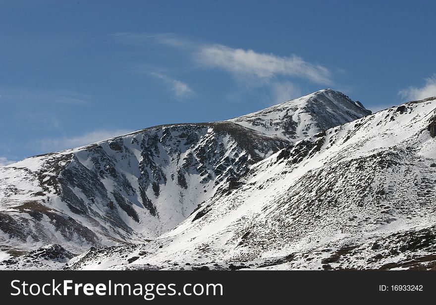 Snow on peak in Colorado during the early fall season. Snow on peak in Colorado during the early fall season.