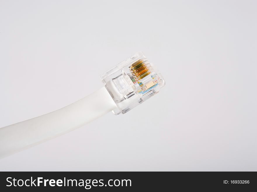 White phone cord against a white background