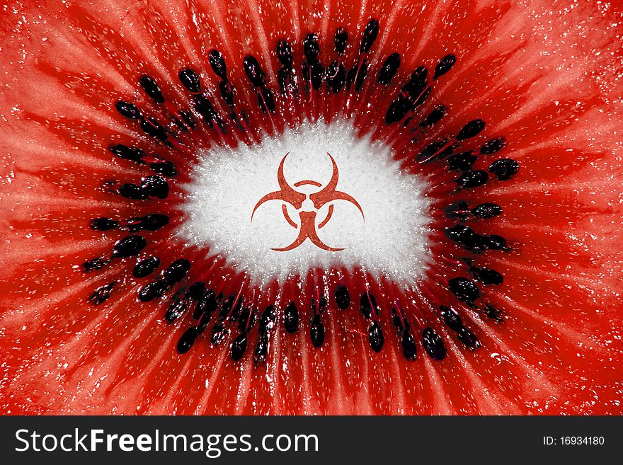 Kiwi fruit pulp well lit in a closeup with hazardous sign an color. Kiwi fruit pulp well lit in a closeup with hazardous sign an color.