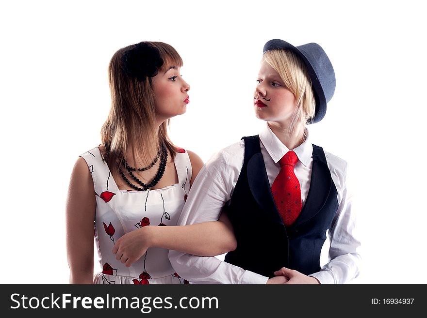 Two girls will wipe friend on friend, girl with drawn moustache in hat