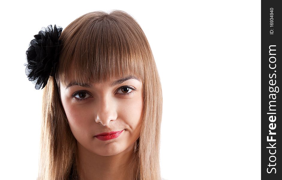 Portrait of the young girl with black rose in hair on white background