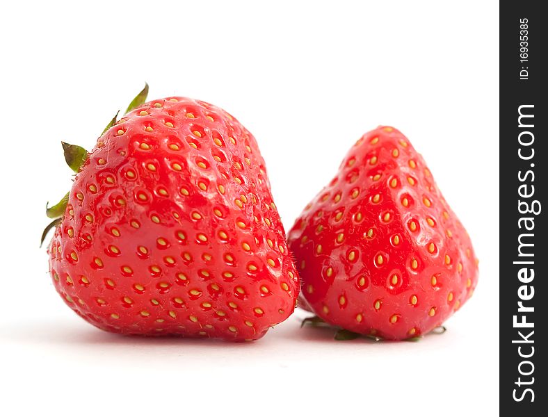 Two juicy strawberries on white background. Two juicy strawberries on white background