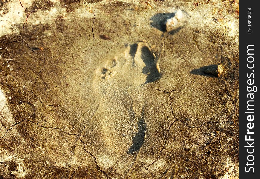 Close up view of foot print on dried and cracked soil. Close up view of foot print on dried and cracked soil