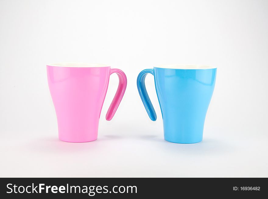 Pink and Blue Cups on white background