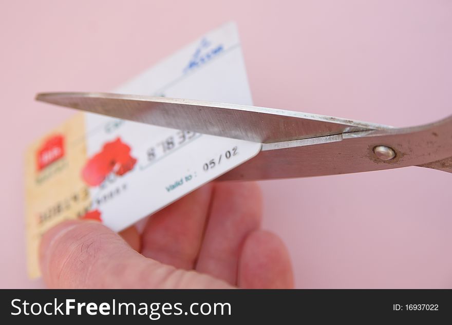 A macro image with selective focus of an electronic  membership card being cut up to prevent identity fraud. A macro image with selective focus of an electronic  membership card being cut up to prevent identity fraud.