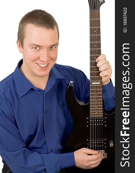 Cheerful young man with a guitar on a white background